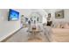 Spacious bonus room with a cozy seating area, a home gym, and ample natural light at 7878 Gull Bay Dr, Awendaw, SC 29429