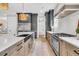 Well-equipped kitchen with a large island, gas range, and stainless steel appliances at 7878 Gull Bay Dr, Awendaw, SC 29429