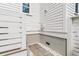 Private outdoor shower featuring a brick floor and white-painted walls at 7878 Gull Bay Dr, Awendaw, SC 29429