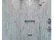 Shower featuring custom blue-gray vertical tiling and chrome fixtures at 7878 Gull Bay Dr, Awendaw, SC 29429