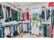 Organized walk-in closet with shelving and storage, plus a window for natural light at 7878 Gull Bay Dr, Awendaw, SC 29429