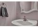 Modern bathroom with a stylish sink, mirror, and towel rack at 7963 Shadow Oak Dr, North Charleston, SC 29406
