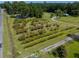 A captivating aerial view showcasing an agricultural setting with cultivated rows and buildings at 806 Appii Rd, Moncks Corner, SC 29461