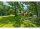Backyard view featuring various storage and garden outbuildings at 806 Appii Rd, Moncks Corner, SC 29461