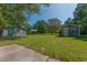 Backyard with various storage and garden outbuildings at 806 Appii Rd, Moncks Corner, SC 29461