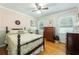 Cozy bedroom with floral wallpaper, hardwood floors, and a comfortable bed at 806 Appii Rd, Moncks Corner, SC 29461