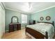 Comfortable bedroom with hardwood floors, light green walls, and traditional furnishings at 806 Appii Rd, Moncks Corner, SC 29461