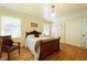 Charming bedroom with wood floors, light yellow walls, and a cozy bed at 806 Appii Rd, Moncks Corner, SC 29461