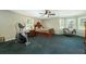 Spacious bedroom featuring a bed, exercise equipment, and large windows at 806 Appii Rd, Moncks Corner, SC 29461