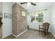 Sunny breakfast nook with a brick accent wall and a large window with a view of the outdoors at 806 Appii Rd, Moncks Corner, SC 29461