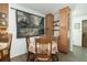 Charming dining area with wood table and chairs, accented by a decorative wall hanging at 806 Appii Rd, Moncks Corner, SC 29461