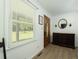 Inviting entryway with wood floors, a classic wood door, and bright natural light from a large window at 806 Appii Rd, Moncks Corner, SC 29461