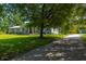 Charming home with a long driveway and mature trees in a lush green yard at 806 Appii Rd, Moncks Corner, SC 29461