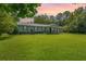 Charming home featuring a metal roof, classic shutters, and a well-manicured lawn perfect for outdoor enjoyment at 806 Appii Rd, Moncks Corner, SC 29461