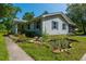 Home exterior featuring pond and landscaping, with hardiplank siding and blue shutters at 806 Appii Rd, Moncks Corner, SC 29461