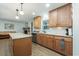 Well-lit kitchen with stainless steel appliances, wooden cabinetry, and an open layout at 806 Appii Rd, Moncks Corner, SC 29461