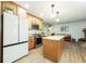 Bright kitchen featuring stainless steel appliances, a center island, and views into the living area at 806 Appii Rd, Moncks Corner, SC 29461