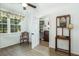 Bright mud room featuring wood-look floors, neutral walls, and decorative window with shelves at 806 Appii Rd, Moncks Corner, SC 29461