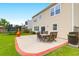 Beautiful backyard patio area offers comfortable seating and a grill for outdoor enjoyment at 9785 Black Willow Ln, Ladson, SC 29456