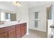 This bathroom has double sinks, wood cabinets and a glass enclosed shower stall at 9785 Black Willow Ln, Ladson, SC 29456
