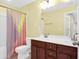 This bathroom has double sinks, dark cabinets, and a tub shower combo at 9785 Black Willow Ln, Ladson, SC 29456