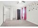 This bedroom has neutral walls and carpet with a closet at 9785 Black Willow Ln, Ladson, SC 29456