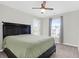Comfortable bedroom featuring a ceiling fan, large window, and a neutral color palette at 9785 Black Willow Ln, Ladson, SC 29456