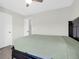 Bright bedroom boasts neutral walls and carpet with a large closet door and comfy bed at 9785 Black Willow Ln, Ladson, SC 29456