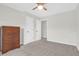 Bedroom with neutral carpet has ceiling fan and a chest of drawers at 9785 Black Willow Ln, Ladson, SC 29456
