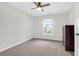 This bedroom has neutral carpet, ceiling fan and a view to the outside at 9785 Black Willow Ln, Ladson, SC 29456