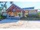 Community lodge entrance with architectural details, offering a welcoming gathering place for residents to socialize at 9785 Black Willow Ln, Ladson, SC 29456