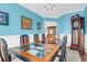 Bright dining room with glass top table and wainscoting at 9785 Black Willow Ln, Ladson, SC 29456