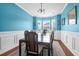 Dining room with bright blue walls and large windows for natural light at 9785 Black Willow Ln, Ladson, SC 29456