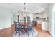 Bright, open-concept kitchen and breakfast nook with wood floors and lots of light at 9785 Black Willow Ln, Ladson, SC 29456