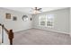 Carpeted landing with stairs, a ceiling fan, and natural light at 9785 Black Willow Ln, Ladson, SC 29456