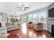 Bright living room featuring an open concept layout with fireplace and eat-in kitchen at 9785 Black Willow Ln, Ladson, SC 29456