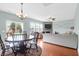 Inviting living space with an open floor plan, fireplace, and access to the backyard at 9785 Black Willow Ln, Ladson, SC 29456