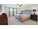 Spacious main bedroom with modern gray decor and great natural light at 9785 Black Willow Ln, Ladson, SC 29456
