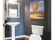 Cozy powder room featuring modern fixtures and a decorative mirror at 9785 Black Willow Ln, Ladson, SC 29456