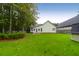 Beautiful backyard with lush green lawn and mature trees at 100 Cheshire Dr, Goose Creek, SC 29445