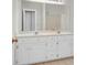 Bright bathroom with double sink vanity and a large mirror for added convenience at 100 Cheshire Dr, Goose Creek, SC 29445