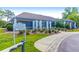Exterior of the community clubhouse featuring well-maintained landscaping and a welcoming entrance at 100 Cheshire Dr, Goose Creek, SC 29445