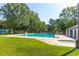 Large community pool surrounded by trees and green space at 100 Cheshire Dr, Goose Creek, SC 29445