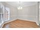 Charming dining room featuring classic wainscoting and a decorative chandelier at 100 Cheshire Dr, Goose Creek, SC 29445