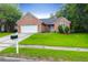 Charming single-story brick home with well-maintained lawn and inviting curb appeal at 100 Cheshire Dr, Goose Creek, SC 29445