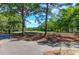 Picturesque view of a community golf course showcasing mature trees and green fairways at 100 Cheshire Dr, Goose Creek, SC 29445