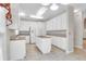 Modern kitchen featuring white cabinets, kitchen island with cooktop, and a double oven at 100 Cheshire Dr, Goose Creek, SC 29445