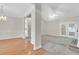 Spacious living room with hardwood floors, fireplace, and large windows at 100 Cheshire Dr, Goose Creek, SC 29445