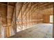 Unfinished attic with exposed beams and plywood flooring, offering potential for customization at 105 Bobcat Ln, Ravenel, SC 29470