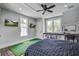 Large bedroom features an indoor putting green, a ceiling fan, and built-in cabinets at 105 Bobcat Ln, Ravenel, SC 29470